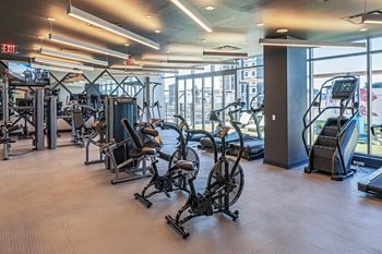 Health club with cardio and weight training equipment